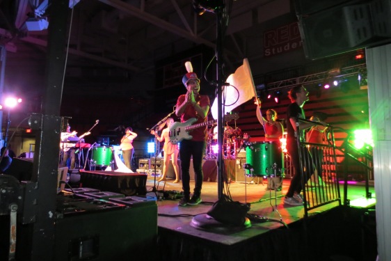 Walk the Moon bassist Kevin Ray performs "Shut Up and Dance" while sporting a Spirit of Stony Brook Marching Band Shako! Photo courtesy of @sbumarchingband 