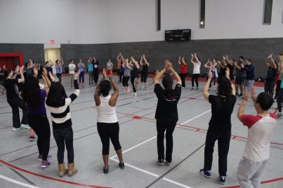 Zumba students dance and workout in a circle to one of the many routines they learned during the 90 minute master class.